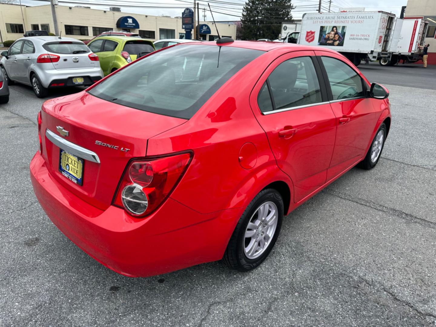 2015 RED Chevrolet Sonic LT Auto Sedan (1G1JC5SH6F4) with an 1.8L L4 DOHC 24V engine, 6-Speed Automatic transmission, located at 1254 Manheim Pike, Lancaster, PA, 17601, (717) 393-9133, 40.062870, -76.323273 - Photo#4